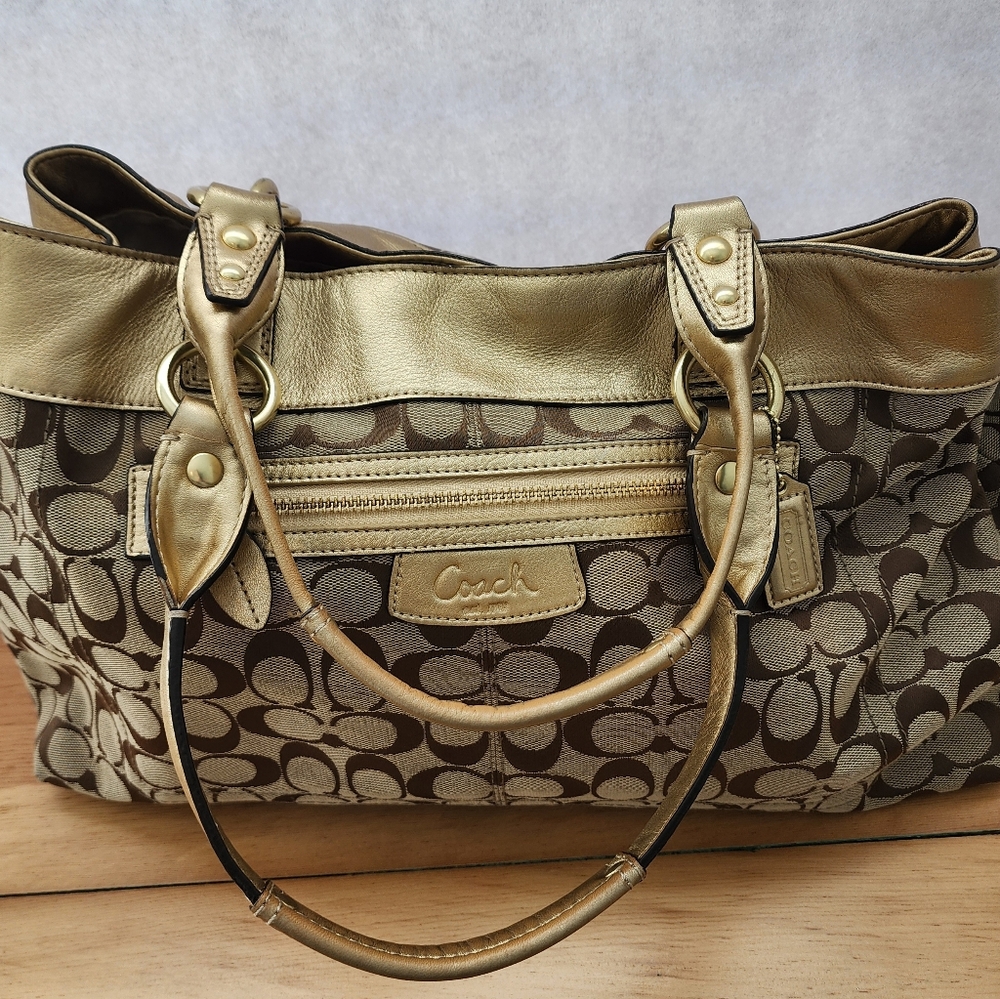 Coach satin gold with brown lettering